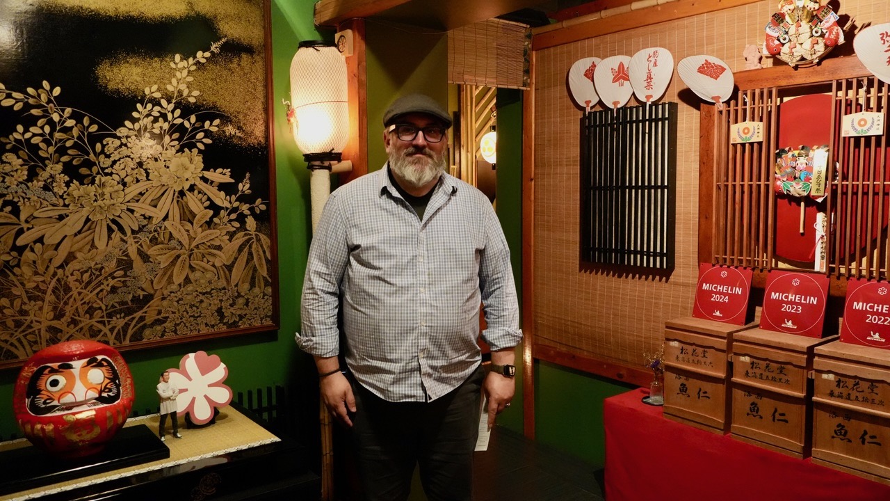 It's me standing in the Kaiseki restaurant next to Michelin signs