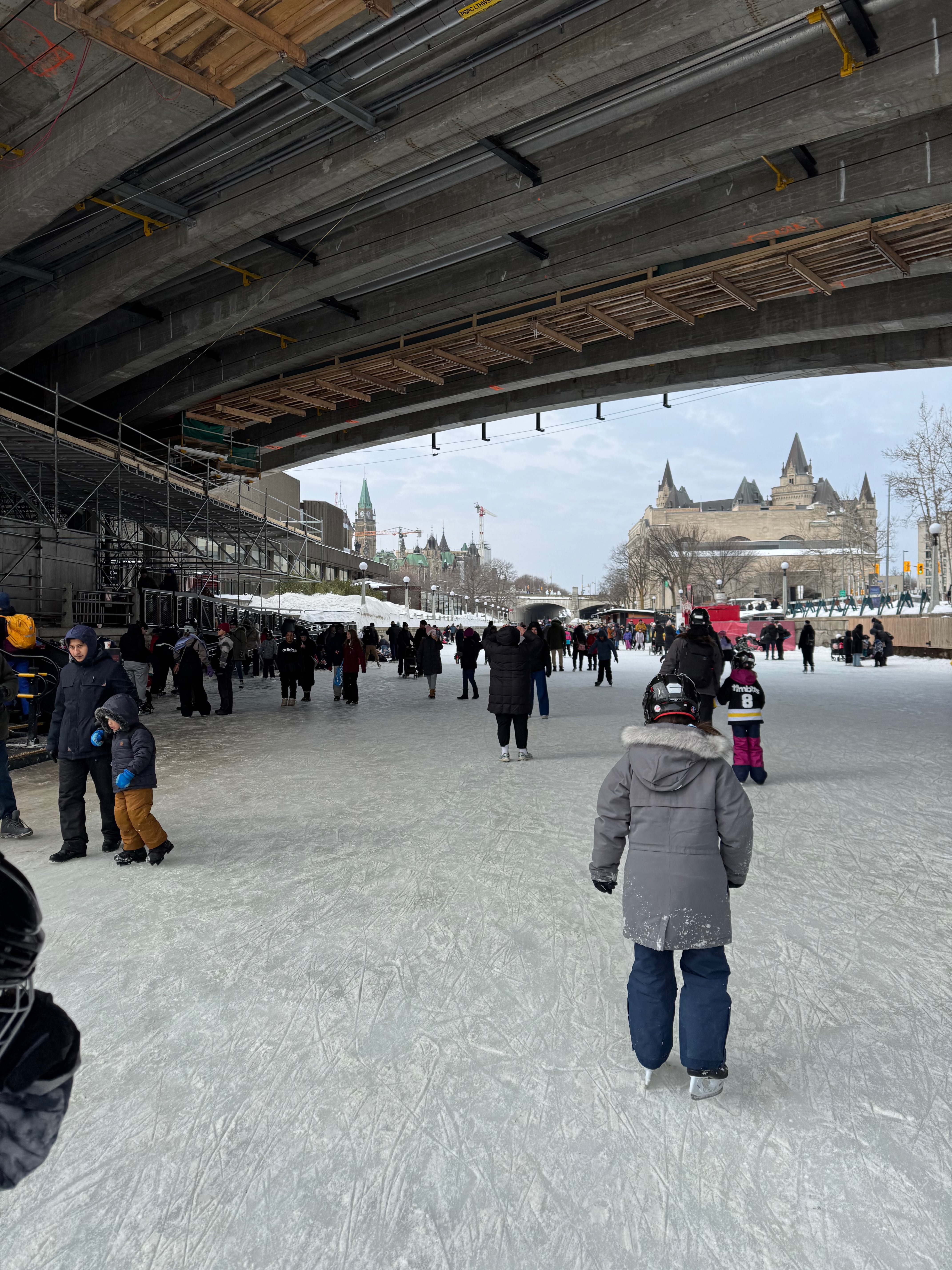 looking down at the skates on my feet standing on ice